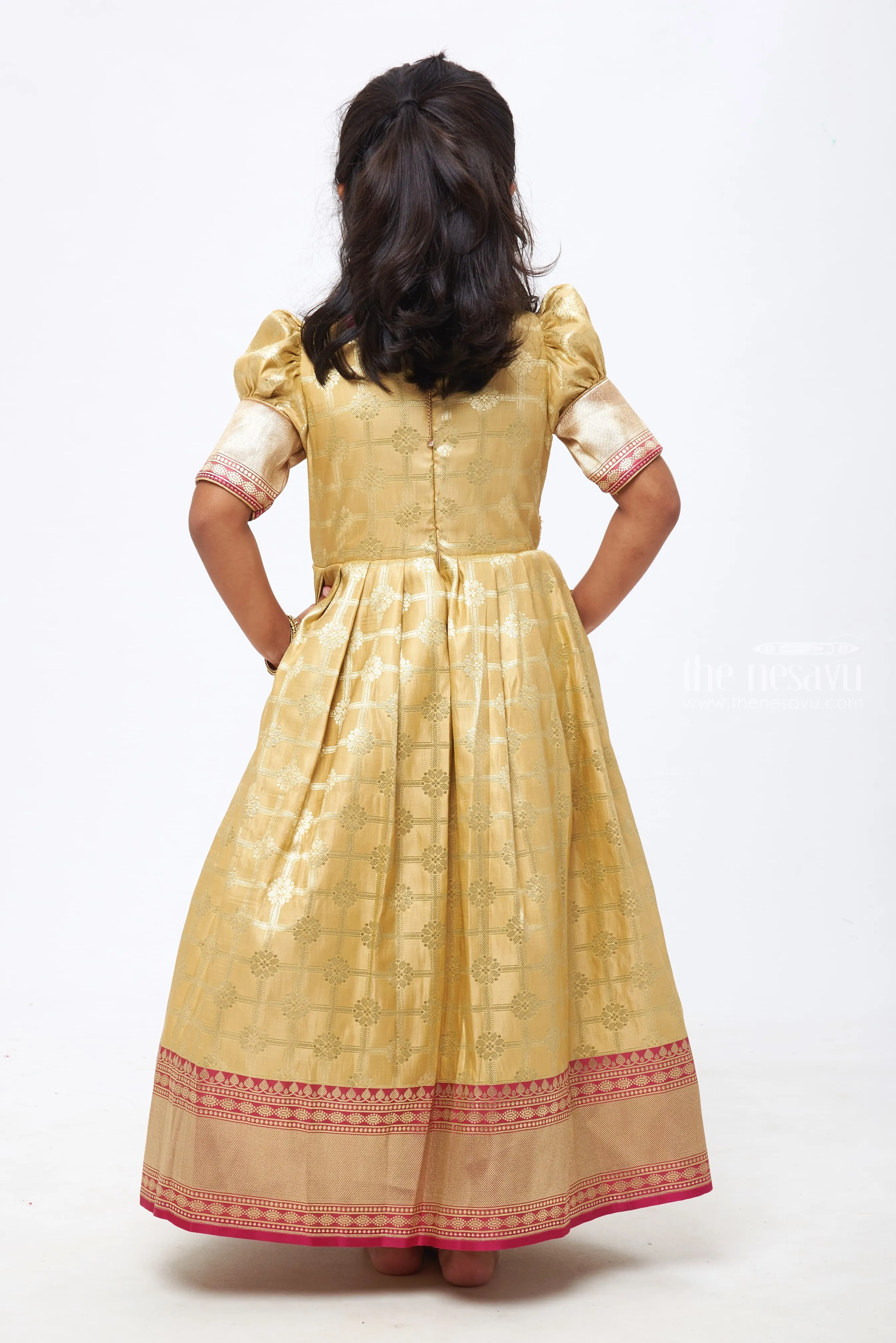 Beige Beauty: Zari Checkered Floral Pleated Gown with Pink Accents for Girls