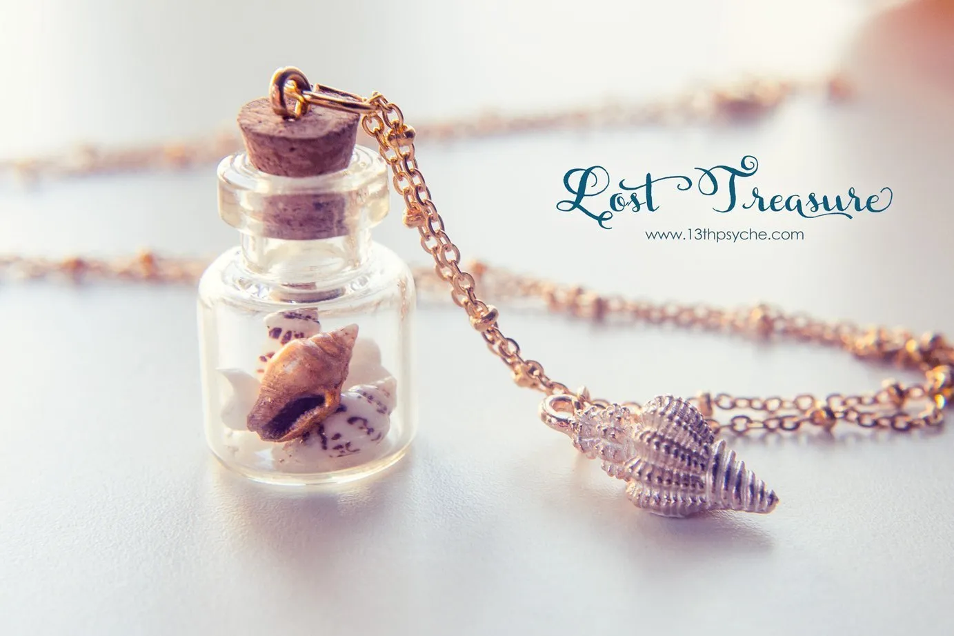 Gold shell bottle pendant necklace