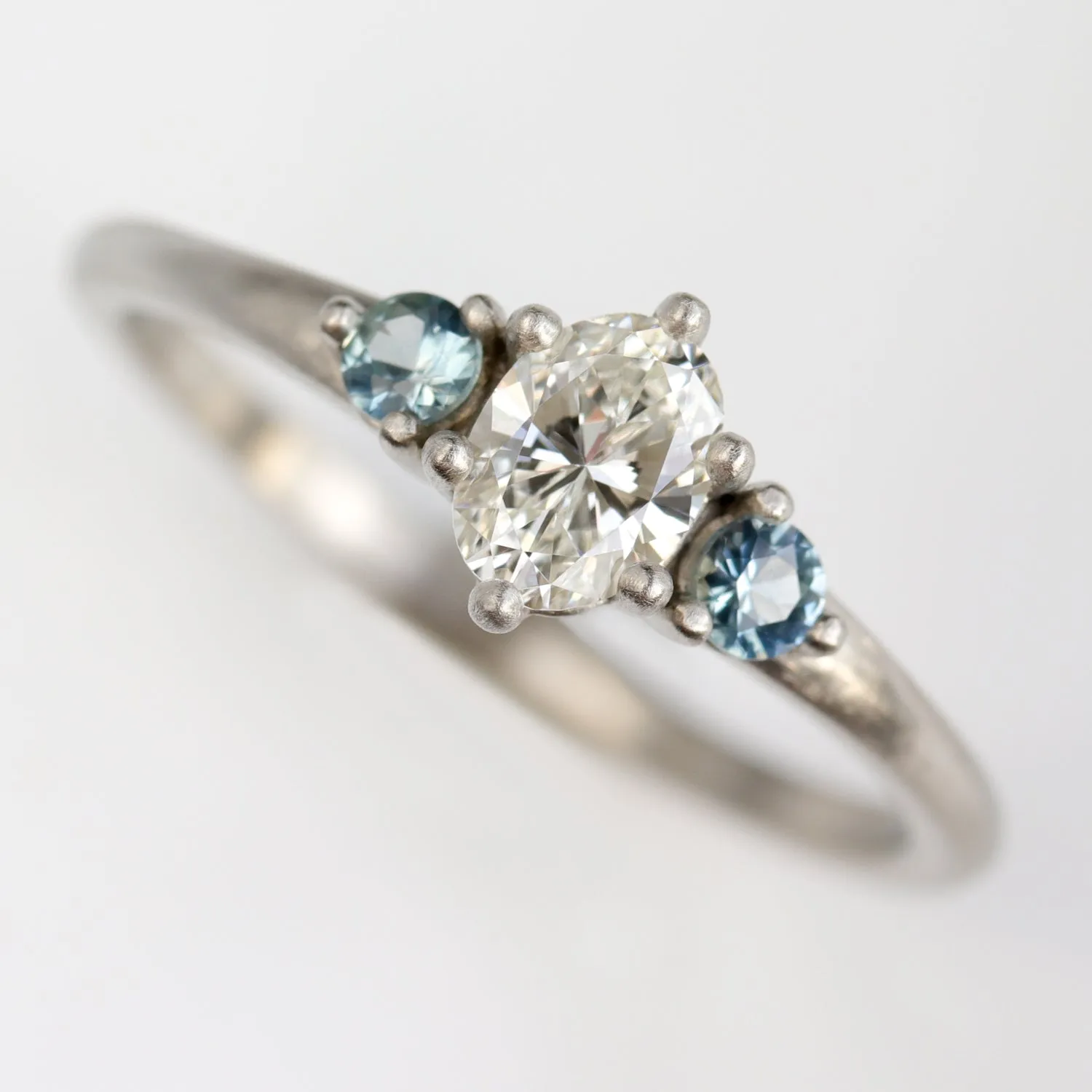 Oval Prong-set Three Stone Ring with Heirloom Stone and Blue Sapphires