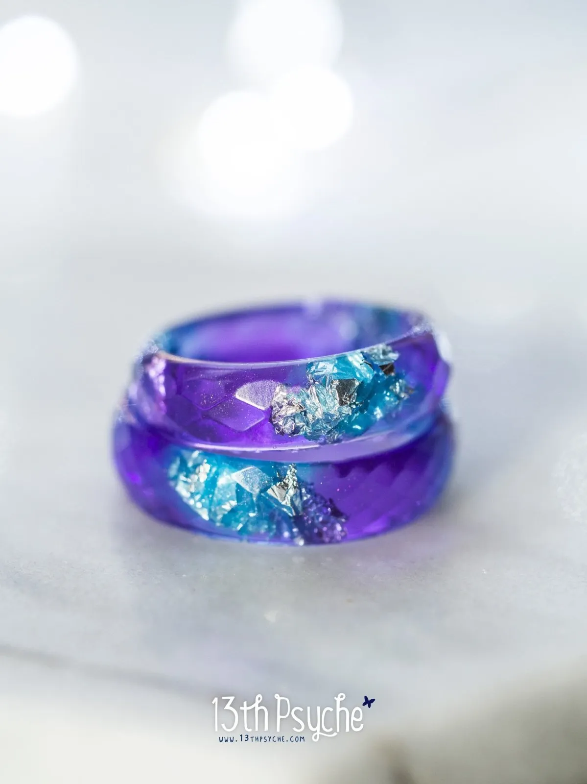 Purple and blue faceted resin ring with silver flakes