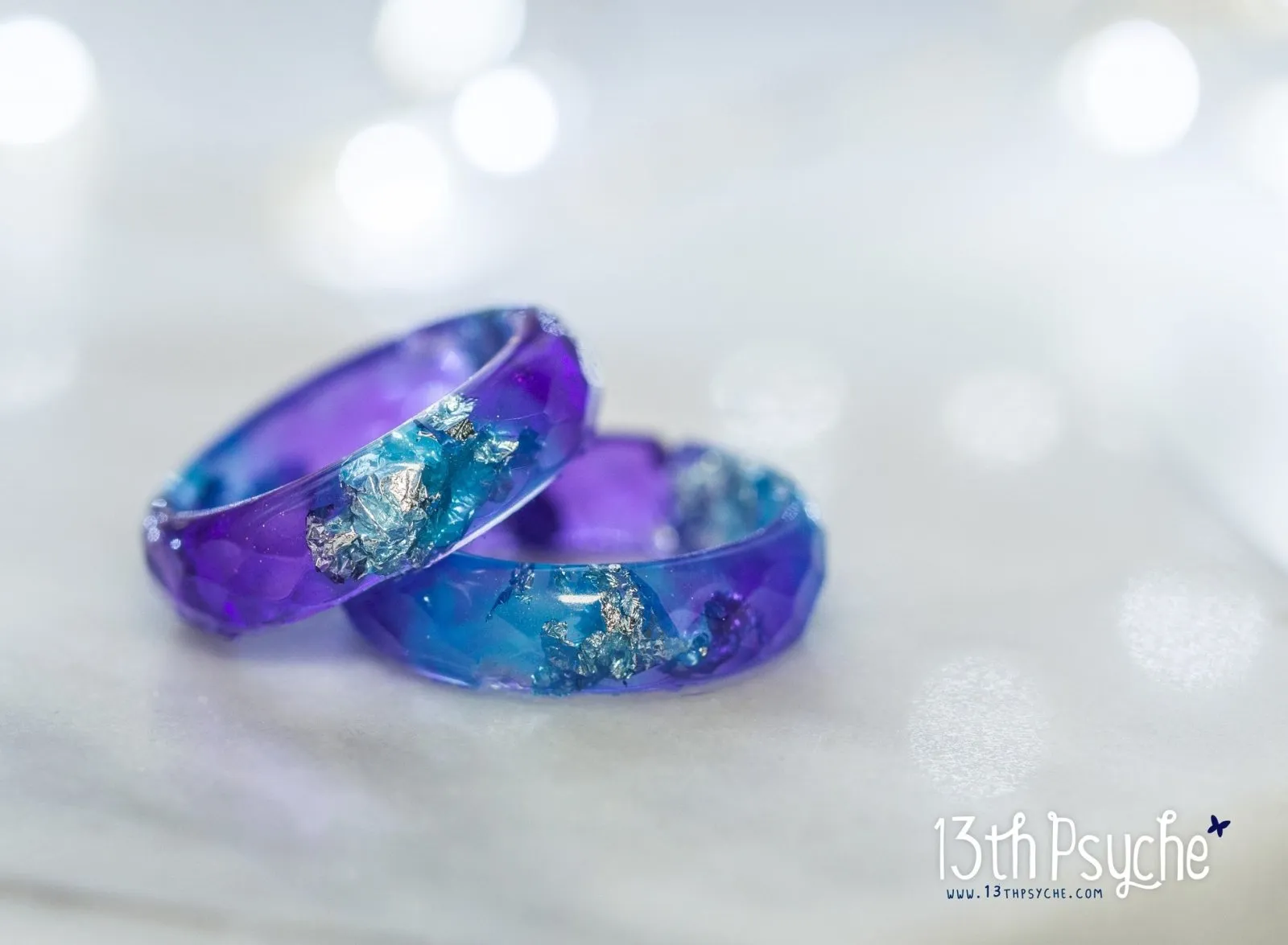 Purple and blue faceted resin ring with silver flakes