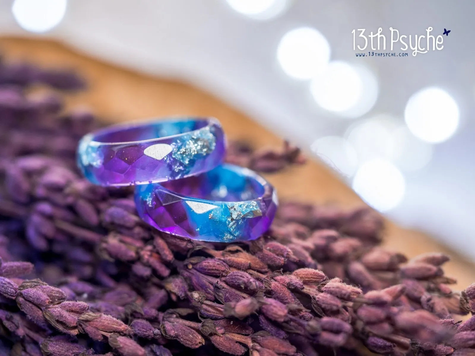 Purple and blue faceted resin ring with silver flakes